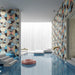 Piscina moderna con rivestimenti in gres porcellanato effetto cementina pop art, formato 120x120 cm, colore azzurro, rosa, grigio e giallo, One Decoro 06 di 41zero42