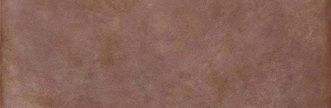 Dettaglio piastrella in gres porcellanato effetto cemento e effetto mattoncino della collezione Terrae di Casalgrande, formato 8x25 cm, colore Mattone