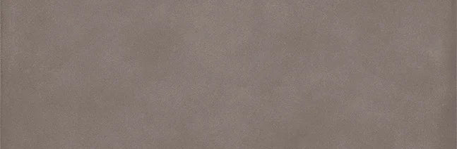 Dettaglio piastrella in gres porcellanato effetto cemento e effetto mattoncino della collezione Terrae di Casalgrande, formato 8x25 cm, colore Tabacco