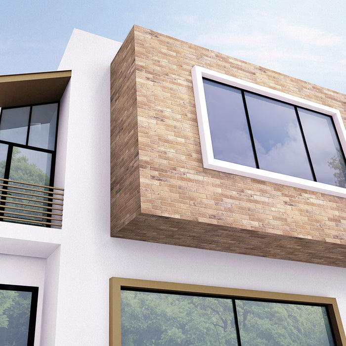 Casa moderna con rivestimento in gres porcellanato effetto mattoncino opaco 6x25 cm della collezione Bristol, colore Cream di Ceramica Rondine