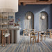 Ristorante moderno blu con pavimento e rivestimento interno in gres porcellanato effetto rigato della collezione Pastel X di Ceramica Rondine, formato 60x120 cm, colore Degradè