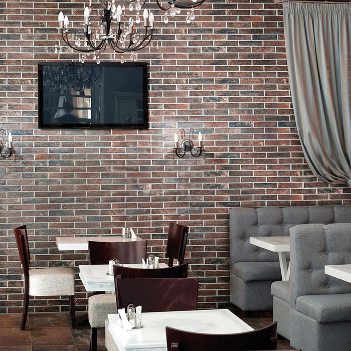 Ristorante con rivestimento in gres porcellanato effetto mattoncino opaco 6x25 cm della collezione Bristol, colore Umber di Ceramica Rondine