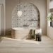 Bagno moderno con vasca in pietra e pavimento in gres porcellanato effetto legno rovere della collezione Dream di Ceramica Rondine, formato 30x120 cm, colore Ivory