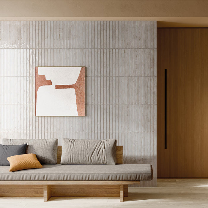 Salotto con rivestimento in gres porcellanato effetto mattoncino lucido 4.8x45 cm della collezione Colors Brick, colore Light Grey di Ceramica Rondine