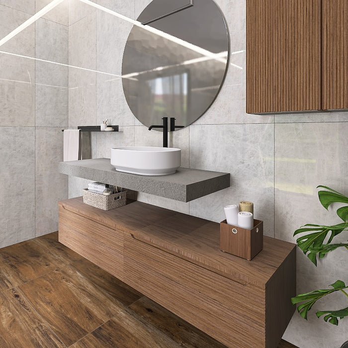 La composizione bagno Penelope 01 si incentra sul top scatolare effetto resina che ospita un lavabo da appoggio bianco. Il pratico pensile a muro e i cassettoni sottostanti offrono massima capienza. Chiude la composizione un grande specchio tondo.