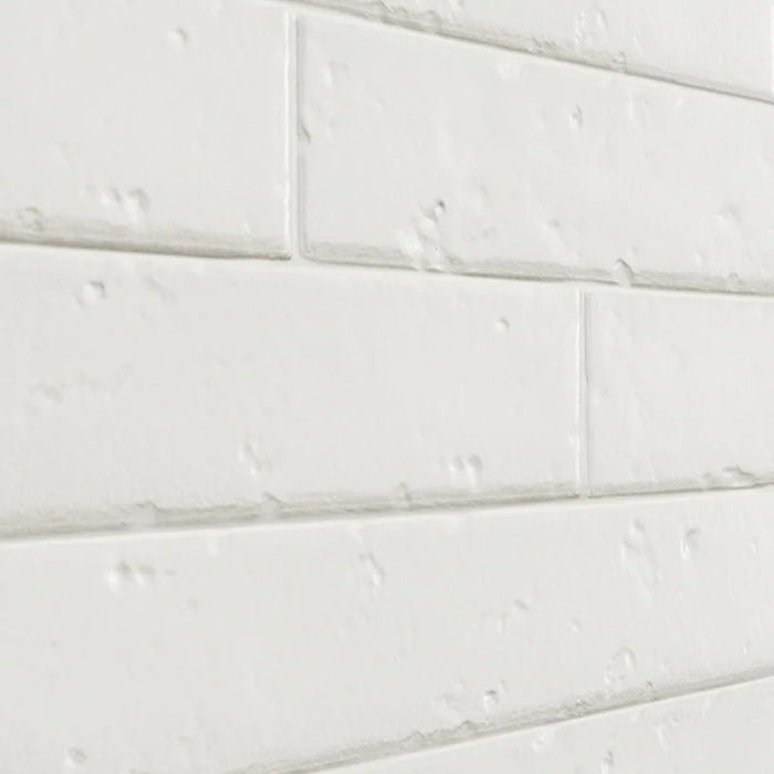 Dettaglio piastrella per rivestimento in gres porcellanato effetto mattoncino rustico opaco 4,5x23 cm della collezione Antique, colore White di Ceramica Settecento
