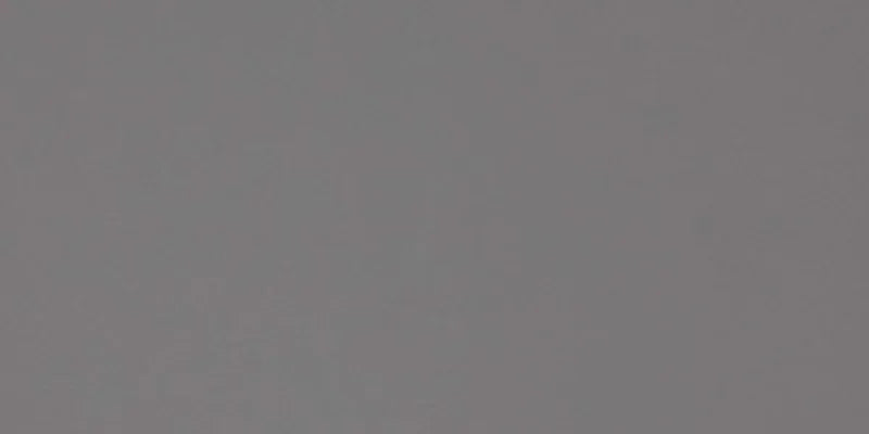 Dettaglio piastrella per pavimento in gres porcellanato effetto resina tinta unita della collezione Architecture di Casalgrande, formato 45x90 rettficato, colore Medium Grey