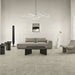 Ambientazione che raffigura un soggiorno contemporaneo e minimalista con piastrelle in gres porcellanato effetto pietra naturale e vissuta, collezione Blendstone di Settecento Ceramica, colore Grey 30x60