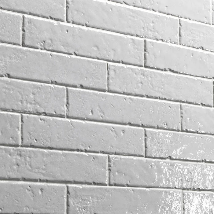 Dettaglio piastrella per rivestimento in gres porcellanato effetto mattoncino rustico Lucido 4,5x23 cm della collezione Brickart, colore Half White di Ceramica Settecento