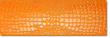 Dettaglio piastrella in gres porcellanato effetto pelle di coccodrillo in rilievo della Collezione Crocotiles di Ceramica Settecento, colore Orange 24x72 cm