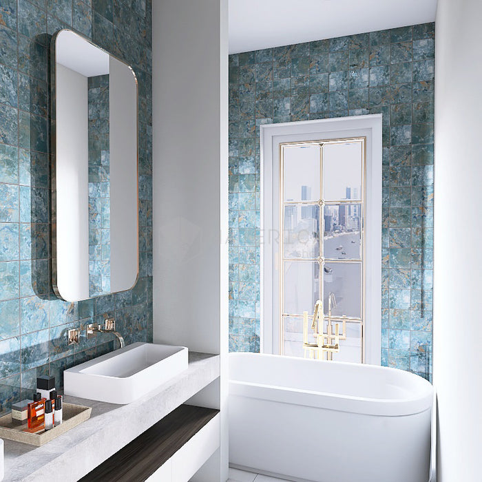 Bagno moderno ed elegante con rivestimento in gres porcellanato effetto pietra spaziale. Collezione Swimming Pool di Ceramica Valsecchia, formato 15x15, Crystal Emerald