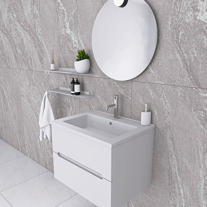 La composizione bagno Pandora 01 cattura l'attenzione con il suo minimale mobile sospeso, caratterizzato da linee pulite e un design essenziale che si integra perfettamente in ogni ambiente moderno. Il top con lavabo integrato in mineralmarmo, lucido e pratico, si abbina splendidamente alla finitura opaca del mobile, garantendo luminosità e facilità di pulizia.