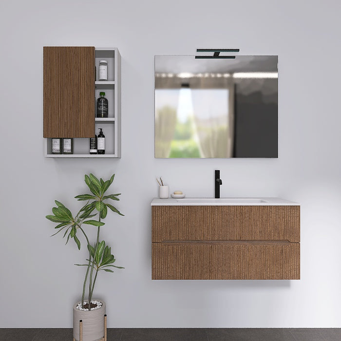 I mobili da bagno della serie Atena presentano una finitura cannettata. Il top con lavabo integrato in mineralmarmo bianco opaco crea un contrasto elegante e pulito. A completare l'insieme, uno specchio rettangolare a filo lucido con una moderna lampada a Led e il pensile, con ante in finitura e vani a giorno
Disponibile nelle finiture: Tortora Opaco, Bianco Opaco, Noce, Rovere e Verde bosco.

