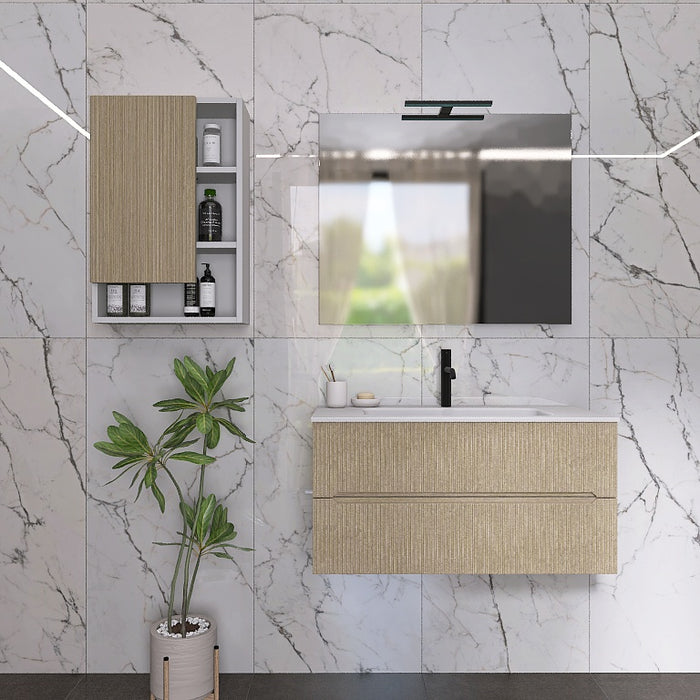 I mobili da bagno della serie Atena presentano una finitura cannettata. Il top con lavabo integrato in mineralmarmo bianco opaco crea un contrasto elegante e pulito. A completare l'insieme, uno specchio rettangolare a filo lucido con una moderna lampada a Led e il pensile, con ante in finitura e vani a giorno
Disponibile nelle finiture: Tortora Opaco, Bianco Opaco, Noce, Rovere e Verde bosco.
