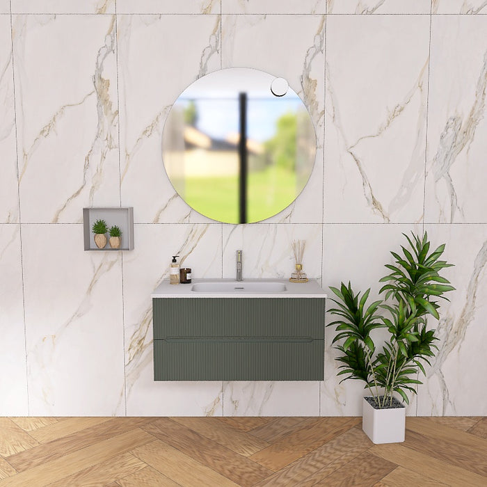 La composizione comprende una base sospesa di piccole dimensioni. La consolle con lavabo integrato in mineralmarmo si abbina a tutte le finiture. Specchio circolare slanciato . Disponibile nelle finiture: Tortora Opaco, Bianco opaco, Verde opaco, rovere e noce.