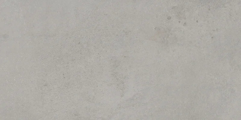 Dettaglio piastrella da pavimento in gres porcellanato effetto cemento 30x60 cm, della collezione Evoque, colore Titanio, di Ceramica Settecento