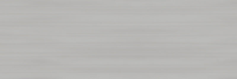 dettaglio piastrella da rivestimento in tinta unita effetto pennellato della collezione Glow di Paul & Co Ceramiche, formato 33x100, colore Grey