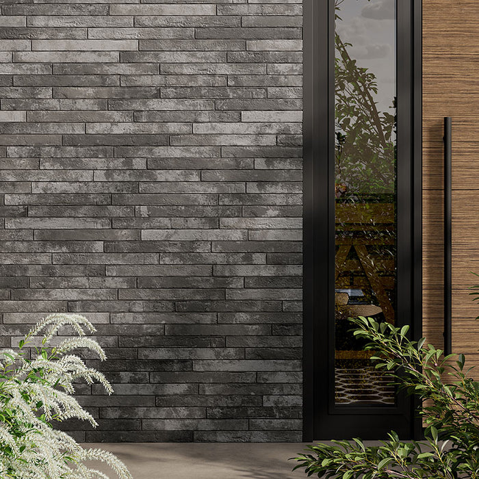 Dettaglio muro esterno con rivestimento in gres porcellanato effetto mattoncino opaco 4.8x45 cm della collezione Harlem, colore Dark Grey di Ceramica Rondine