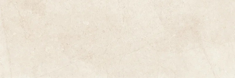 Piastrella per rivestimenti in bicottura pasta bianca effetto pietra della collezione Indira di Idea Ceramica, formato 33x100 cm, colore Cream