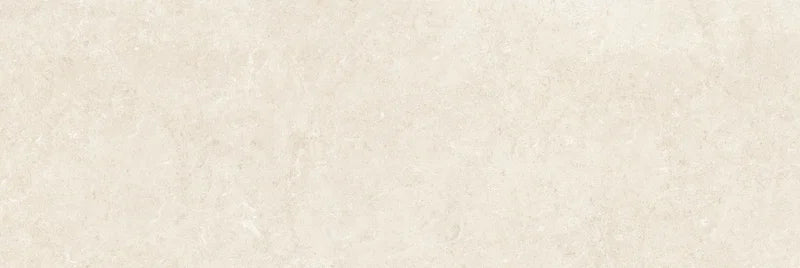 Piastrella per rivestimenti in bicottura pasta bianca effetto pietra della collezione Indira di Idea Ceramica, formato 33x100 cm, colore Cream