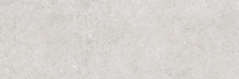 Piastrella per rivestimenti in bicottura pasta bianca effetto pietra della collezione Indira di Idea Ceramica, formato 33x100 cm, colore Grey