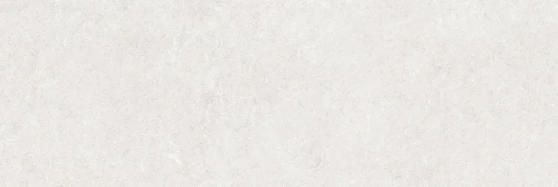 Piastrella per rivestimenti in bicottura pasta bianca effetto pietra della collezione Indira di Idea Ceramica, formato 33x100 cm, colore Ice
