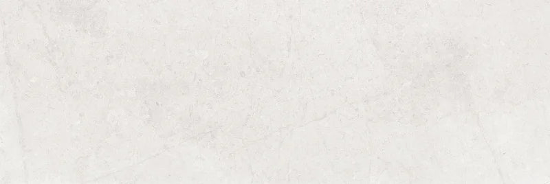 Piastrella per rivestimenti in bicottura pasta bianca effetto pietra della collezione Indira di Idea Ceramica, formato 33x100 cm, colore Ice