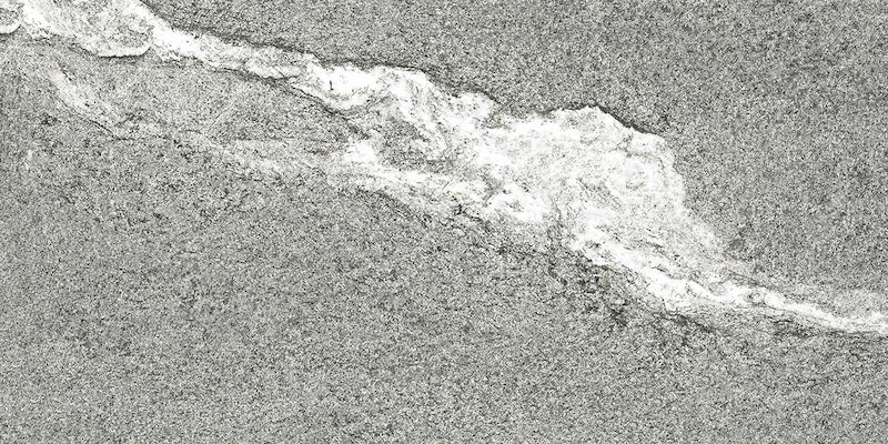 Dettaglio piastrella in gres porcellanato effetto pietra. Percorsi Frame di ceramiche keope 30x60 colore Gneiss Grey