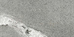 Dettaglio piastrella in gres porcellanato effetto pietra. Percorsi Frame di ceramiche keope 30x60 colore Gneiss Grey