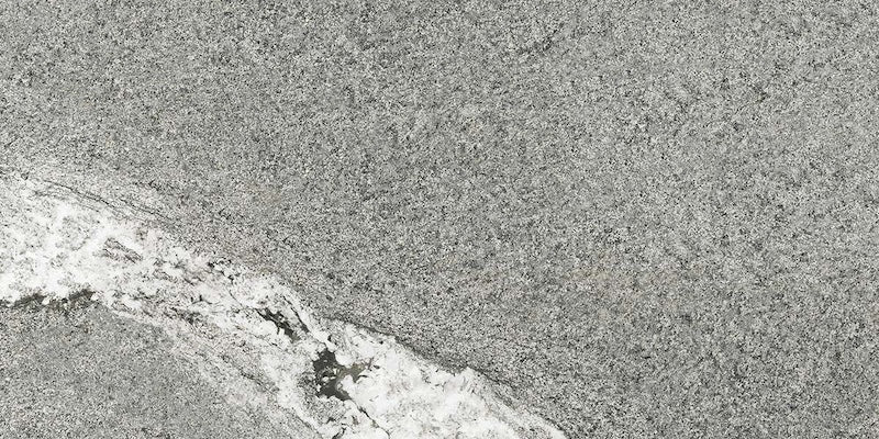 Dettaglio piastrella in gres porcellanato effetto pietra. Percorsi Frame di ceramiche keope 30x60 colore Gneiss Grey