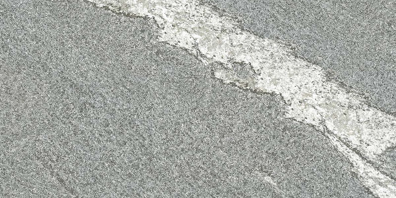 Dettaglio piastrella in gres porcellanato effetto pietra per esterni. Percorsi Frame di ceramiche keope 30x60 antiscivolo colore Gneiss Grey