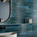Dettaglio bagno moderno con rivestimento in gres porcellanato effetto mattoncino lucido a rilievo della collezione Life di Ceramica Rondine, formato 4.8x45 cm, colore 3D Slide Petrol