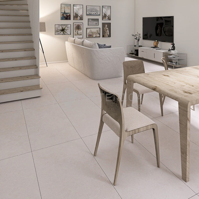 Soggiorno con pavimento in gres porcellanato effetto pietra naturale della collezione la geoteca nella colorazione Limestone di gardenia orchidea 60x120