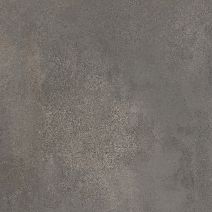 Dettaglio piastrella da pavimento e rivestimento in gres porcellanato effetto cemento industriale della collezione Make di Gardenia Orchidea, formato 60x60, colore Antracite Corten