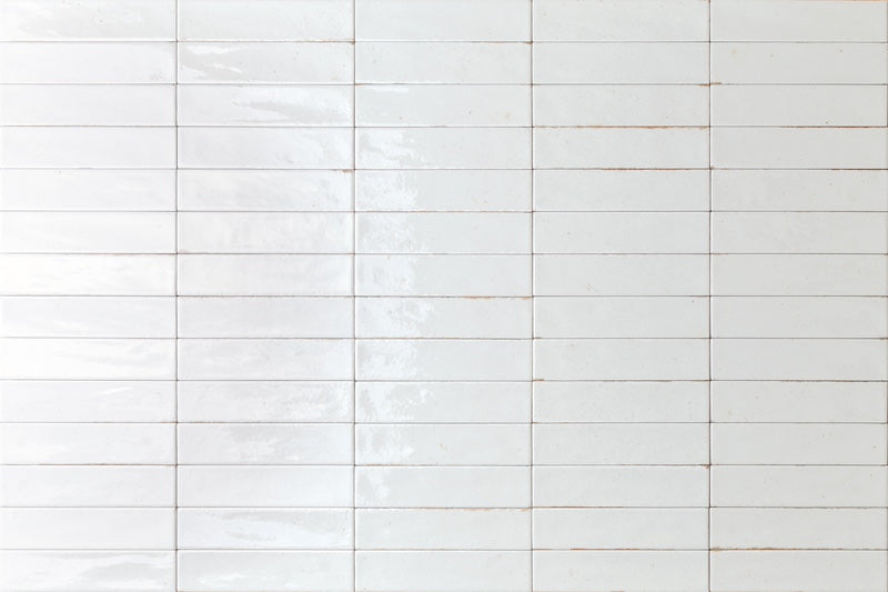 Dettaglio piastrella con rivestimento in gres porcellanato effetto mattoncino lucido 6x25 cm della collezione Soho, colore White di Ceramica Rondine