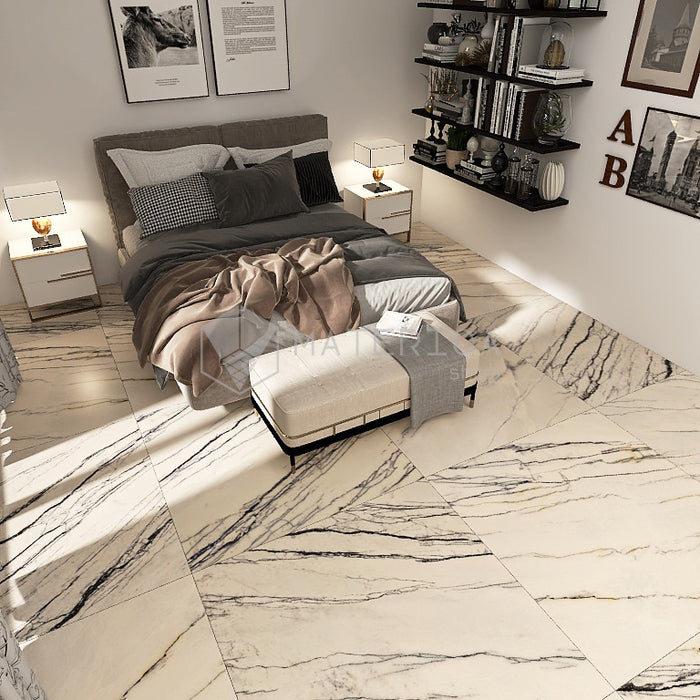 Camera da letto con pavimento dal design sofisticato ed elegante in gres porcellanato effetto marmo opaco, ideale per ambienti moderni e raffinati. Collezione La Marmoteca di Gardenia Orchidea, formato 120x120 cm, colore Pearl Deluxe