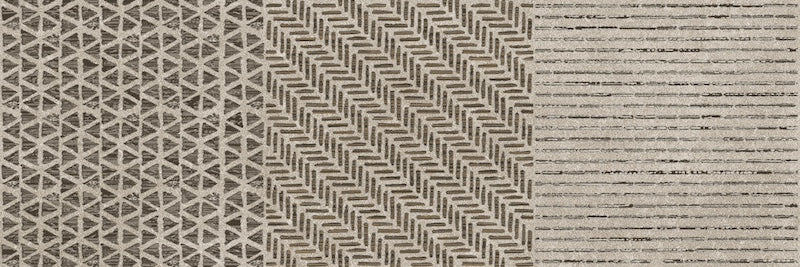 Dettaglio piastrella da rivestimento effetto Geometrico leggermente a rilievo opaco con riflessi lucidi della collezione Pietra di Luna di Paul & Co Ceramiche, formato 25x75, colore Galassie Sabbia