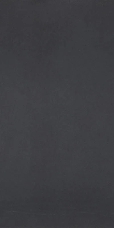 Dettaglio piastrella in gres porcellanato effetto cemento nuvolato della collezione R-Evolution di Casalgrande, formato 60x120 cm, colore Black