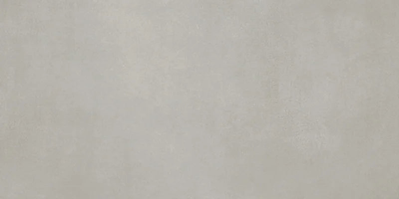 Dettaglio piastrella in gres porcellanato effetto cemento nuvolato della collezione R-Evolution di Casalgrande, formato 30x60 cm, colore Grey