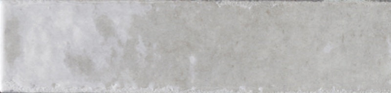 Dettaglio piastrella con rivestimento in gres porcellanato effetto mattoncino lucido 6x25 cm della collezione Soho, colore Light Grey di Ceramica Rondine