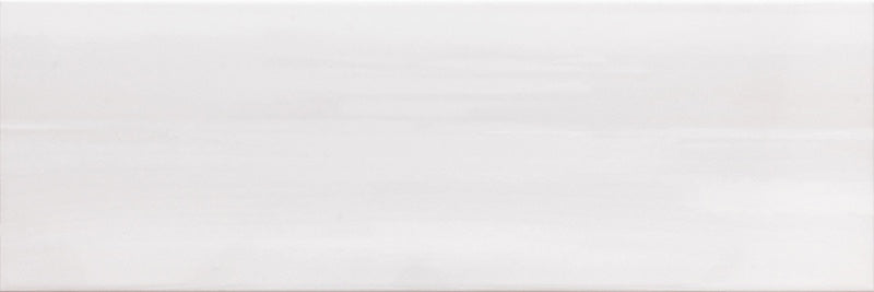 Dettaglio piastrella da rivestimento effetto tinta unita pennellato lucido della collezione Studio di Paul & Co Ceramiche, formato 25x75, colore Bianco
