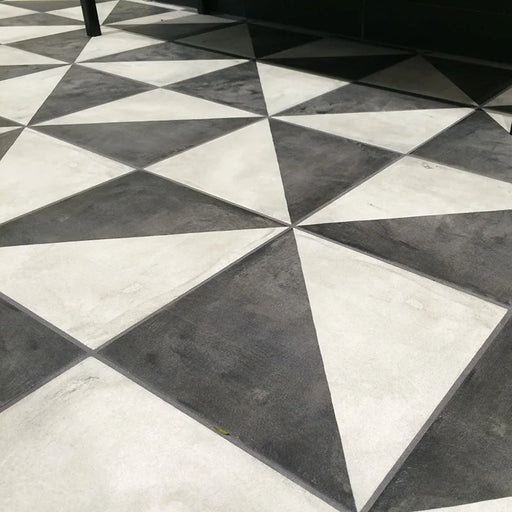 Dettaglio pavimento in gres porcellanato serie Terra di Marca Corona, effetto cementine, formato 20x20 cm, Colore Triangolo Freddo
