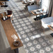 Ristorante con pavimento in gres porcellanato effetto cementina decorata geometrica. Collezione Cementine Home di Ceramica Valsecchia, formato 20x20, C6