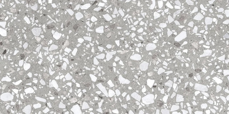 Dettaglio piastrella in gres porcellanato effetto graniglia e marmetta. Collezione Venexia di Alfalux, formato 30x60 cm, colore Murano Grigio con marmette grigie e bianche