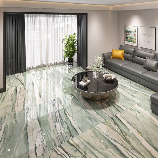 Salotto con pavimento dal design sofisticato ed elegante in gres porcellanato effetto marmo lucido 3D leggermente strutturato, ideale per ambienti moderni e raffinati. Collezione La Marmoteca di Gardenia Orchidea, formato 120x120 cm, colore Verde Picasso