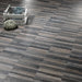 Pavimento in gres porcellanato effetto parquet a listellini 15,7x97 cm della collezione Wooddesign, colore Smoke, di Ceramica Settecento