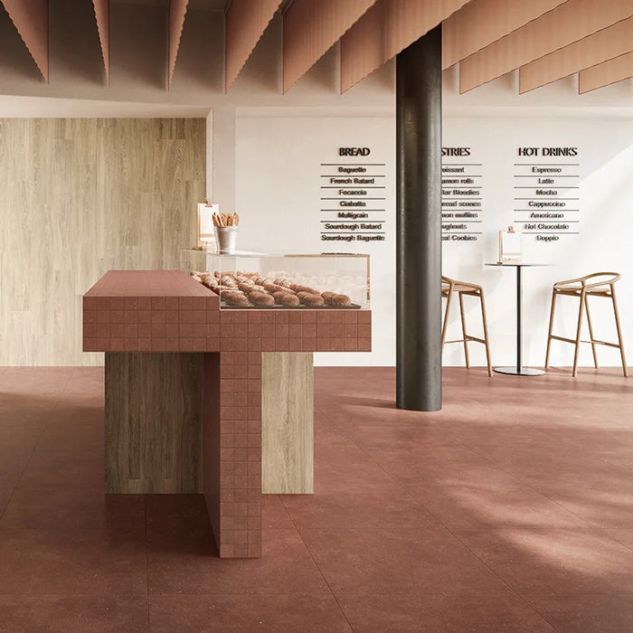 Dettaglio piastrella in gres porcellanato effetto cemento nuvolato opaco della collezione Concept di Casalgrande, formato 60x60 cm, colore Red