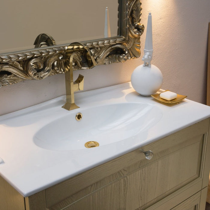 foro del lavabo concolle in ceramica bianca lucida del mobile Dorian in stile classico in finitura dorata con specchio brocantage lavorato a rilievo in finitura oro
