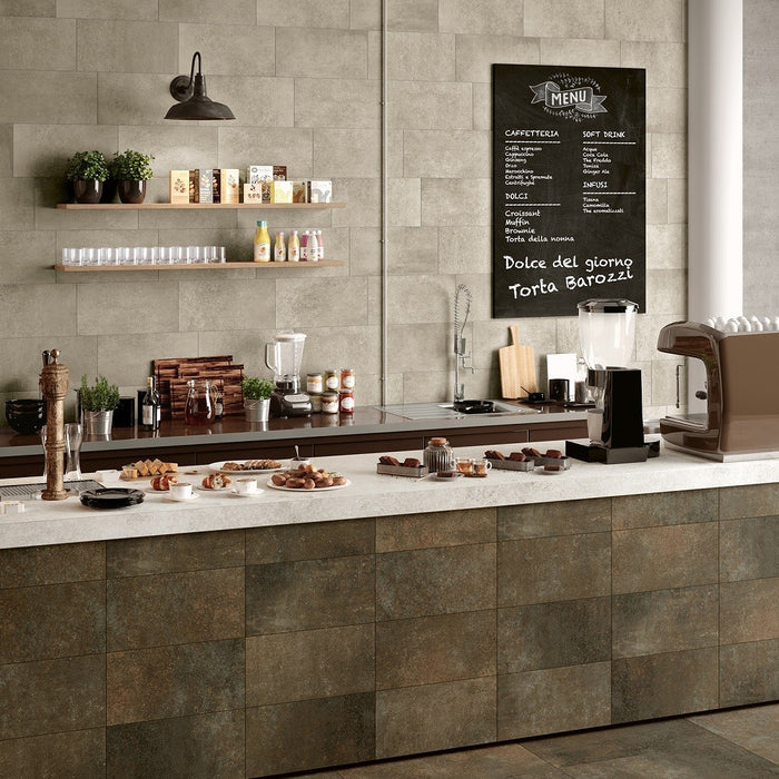 Caffetteria con rivestimento in gres porcellanato effetto cemento, collezione materia di herberia ceramica colore bronzo