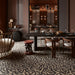 Sala da prazo di lusso con pavimento in gres serie Nok di 41zero42, effetto argilla con decoro tribale opaco, formato 120x120 cm, Colore Snake Taupe